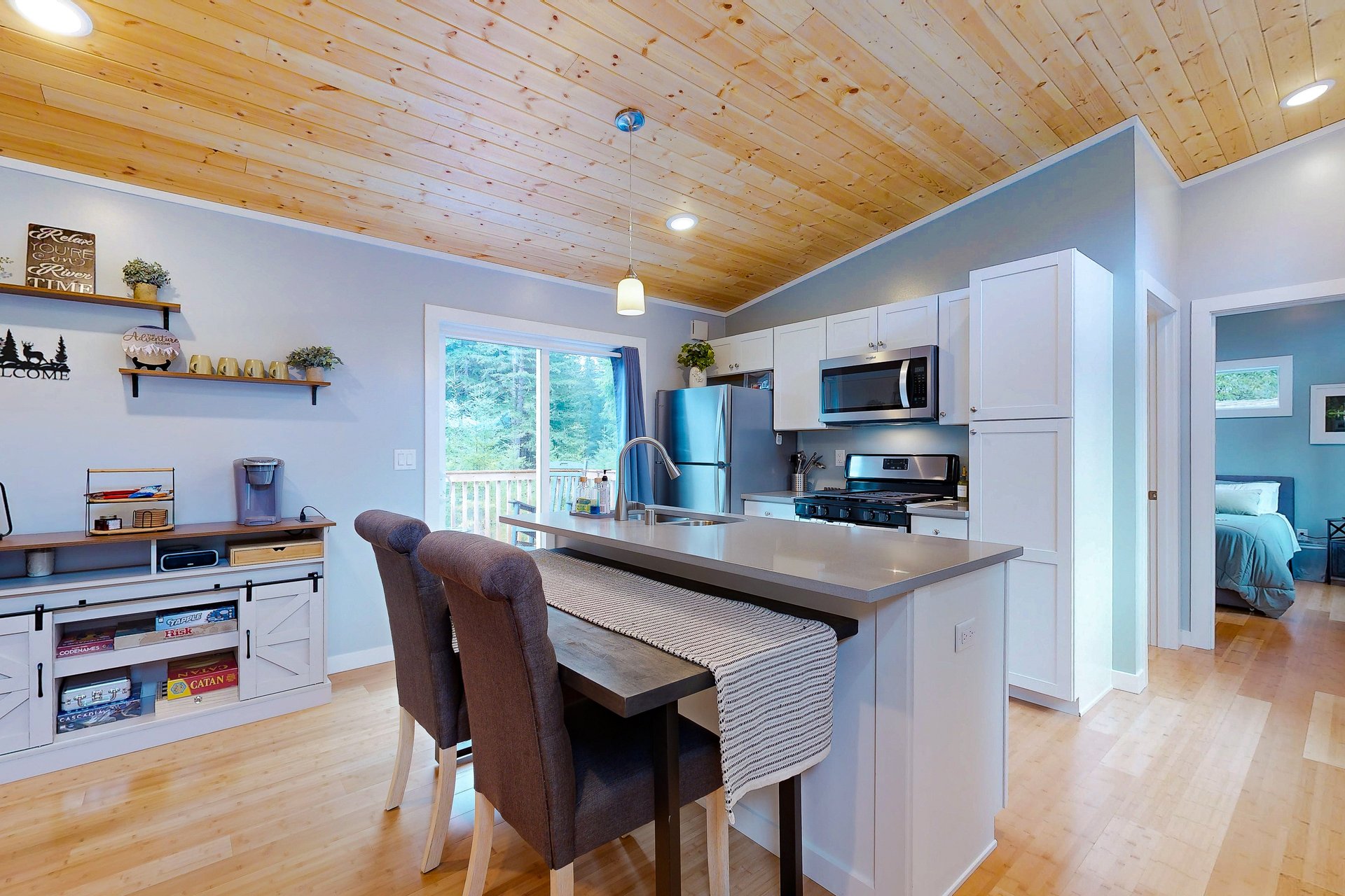 Open floor plan with kitchen island and board games