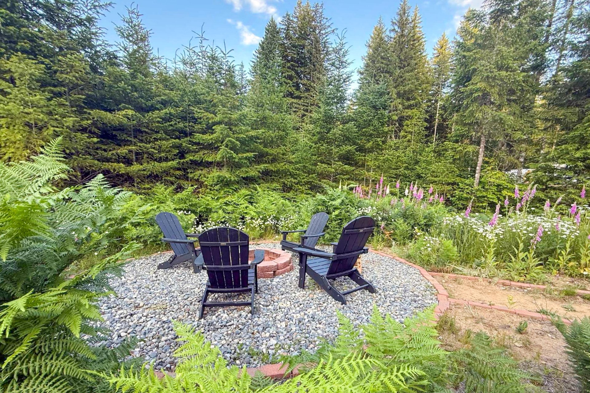 Spacious fire pit seating surrounded by nature